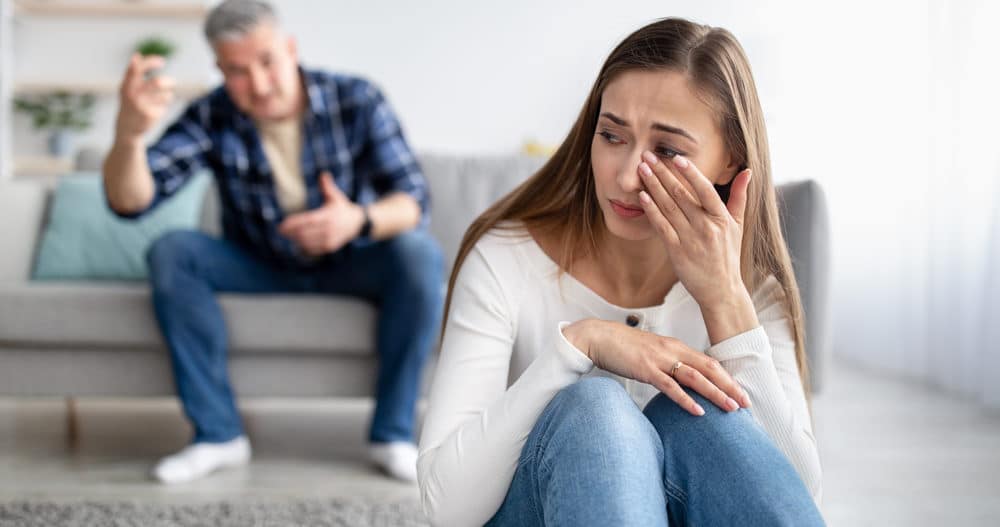Woman being gaslit by man